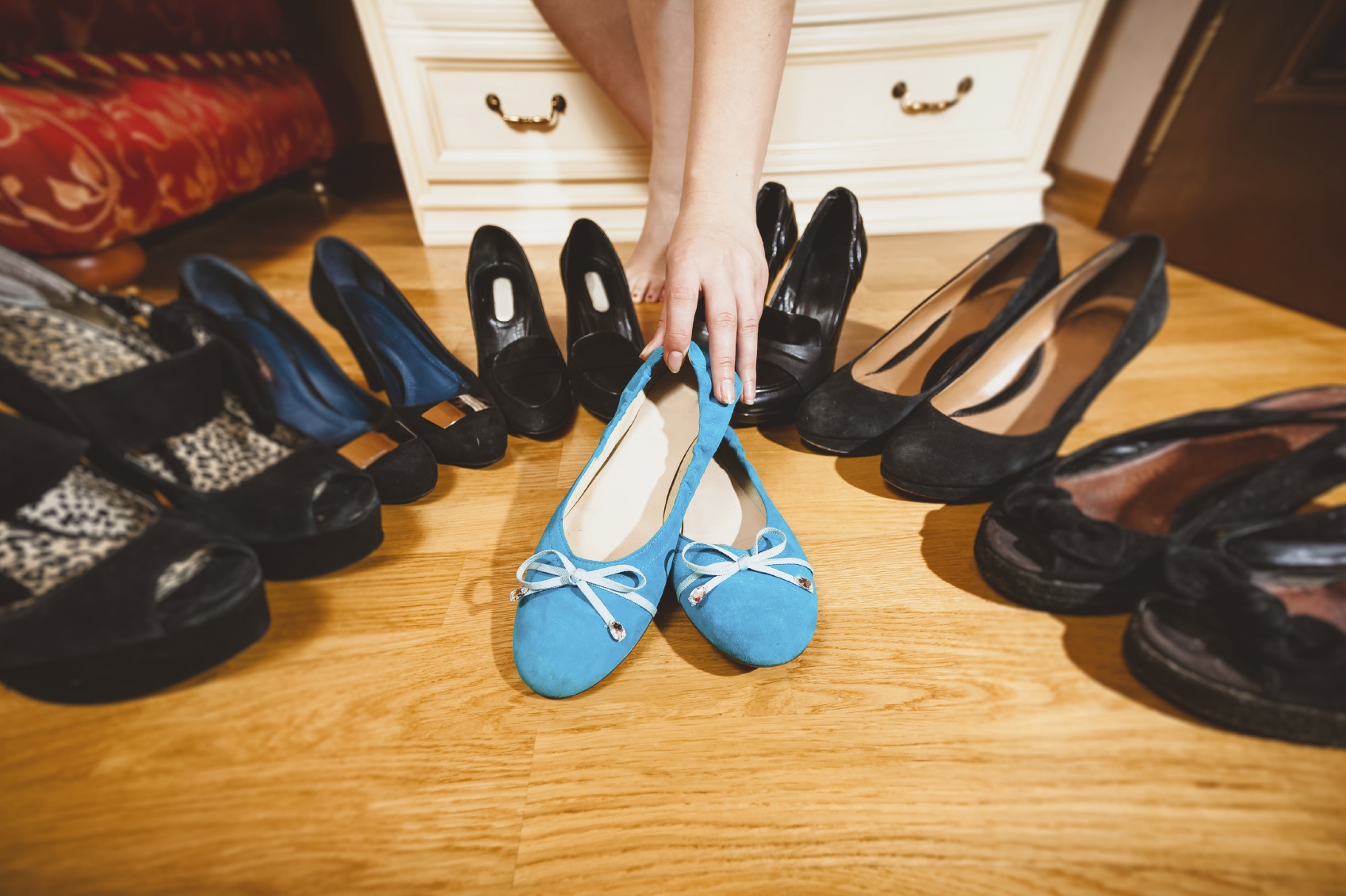 woman picking ballet flats rather than high heels
