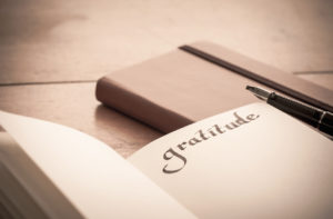 Notebook on Wooden Table - Gratitude Journal